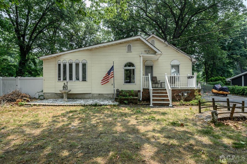 240 Lloyd Road Aberdeen, NJ 07747 - Photo 29 of 29 a view of a house with backyard