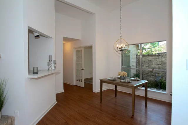 a room with wooden floor and furniture