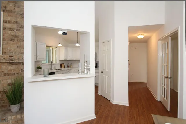a view of a kitchen from a hallway