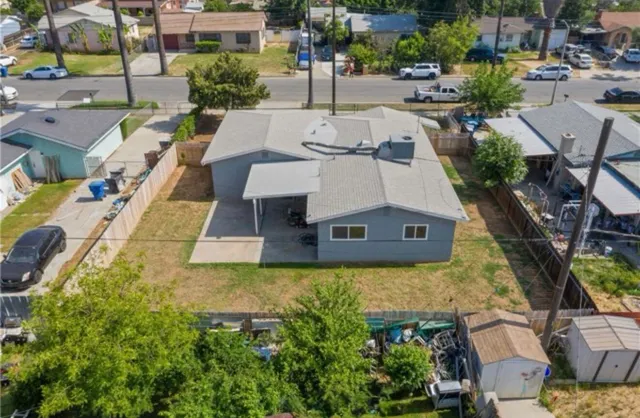 aerial view of a house with swimming pool and sitting area