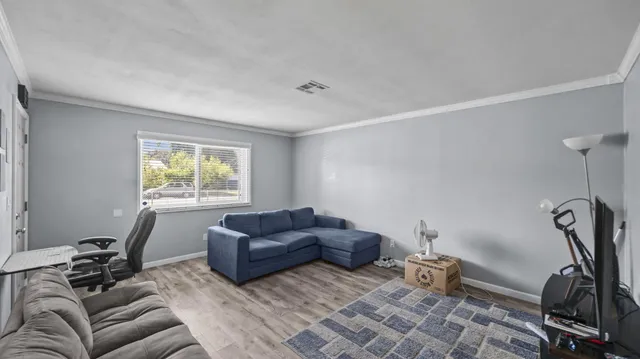 a living room with furniture and a window