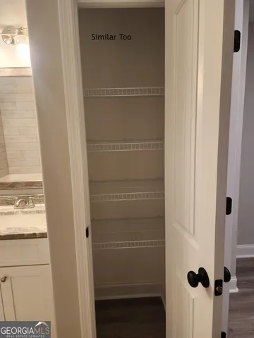 a view of a room with racks on the wall