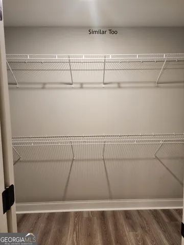 a view of a room with racks on the wall