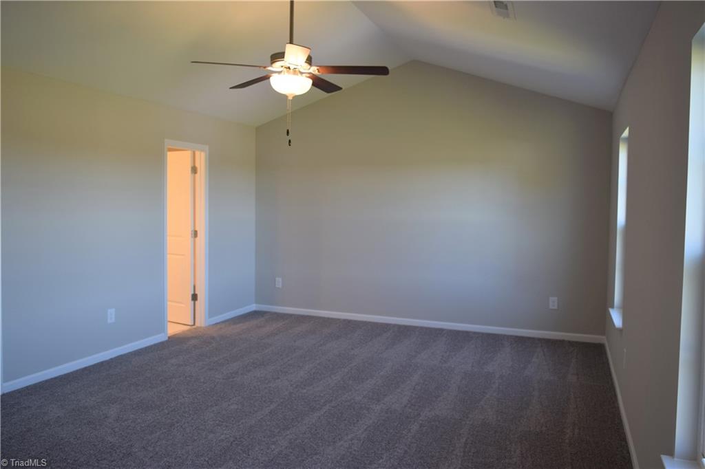 150 Tilly Road Madison, NC 27025 - Photo 16 of 38 Master bedroom with vaulted ceiling