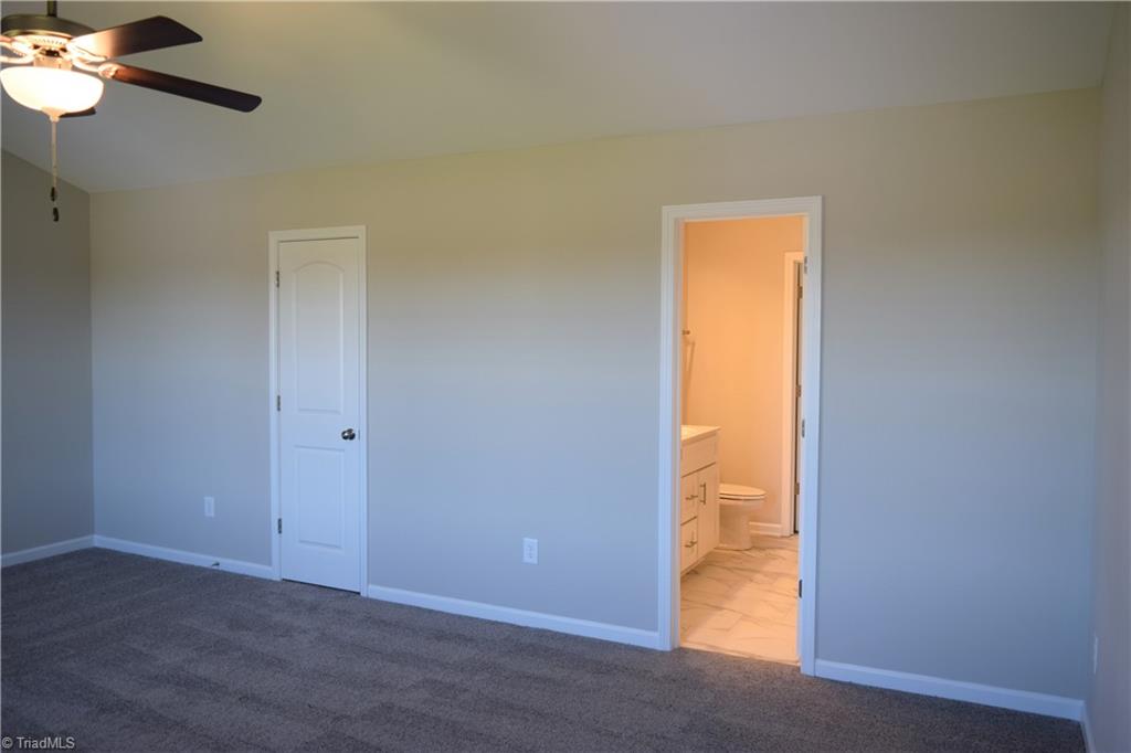 150 Tilly Road Madison, NC 27025 - Photo 18 of 38 Master bedroom has 2 walk-in closets, 1st one accessed in bedroom