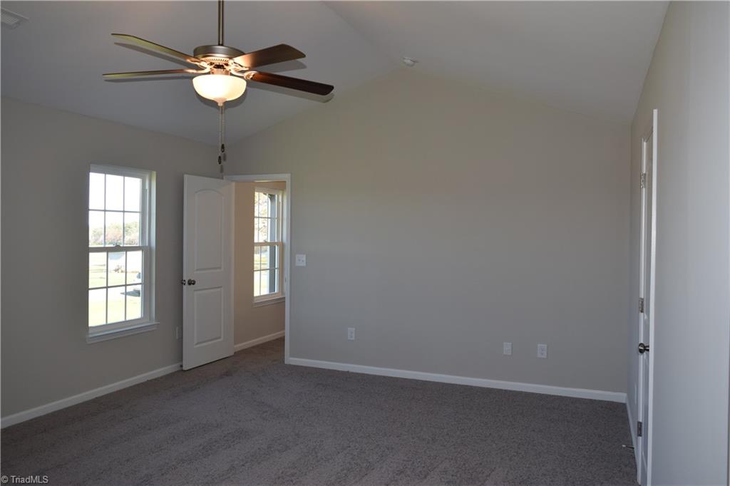 150 Tilly Road Madison, NC 27025 - Photo 19 of 38 Lot of natural lighting in master bedroom