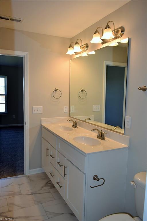 150 Tilly Road Madison, NC 27025 - Photo 22 of 38 Master bath has double sink vanity