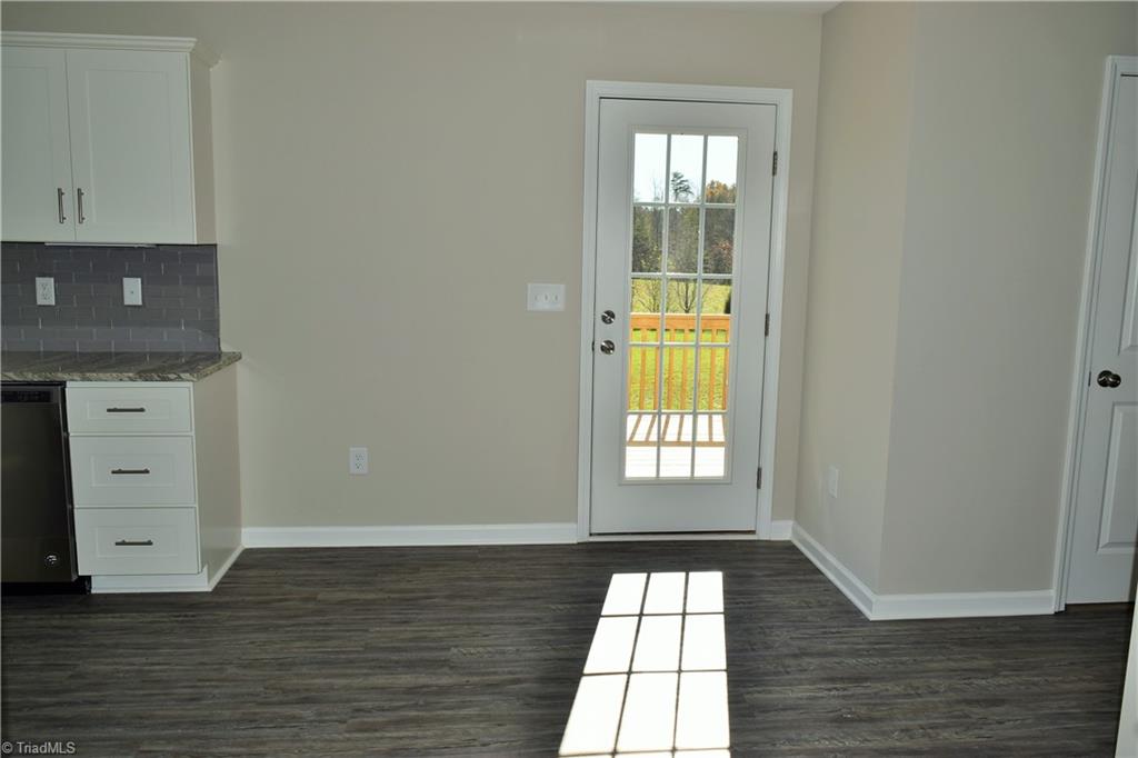 150 Tilly Road Madison, NC 27025 - Photo 9 of 38 Dining area open to kitchen and has a door to back deck