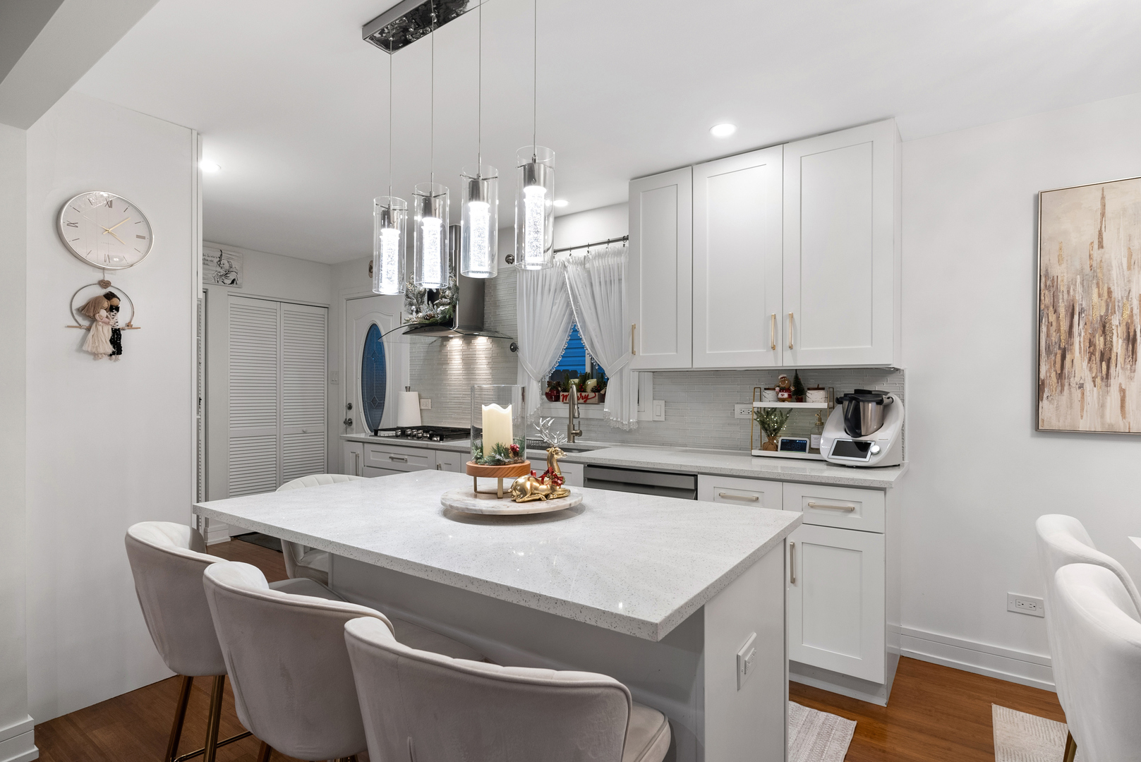 8239 Sayre Avenue Burbank, IL 60459 - Photo 4 of 30 a kitchen with a dining table chairs and white cabinets