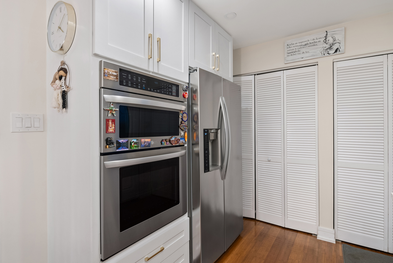 8239 Sayre Avenue Burbank, IL 60459 - Photo 7 of 30 a kitchen with stainless steel appliances a refrigerator a stove and cabinets