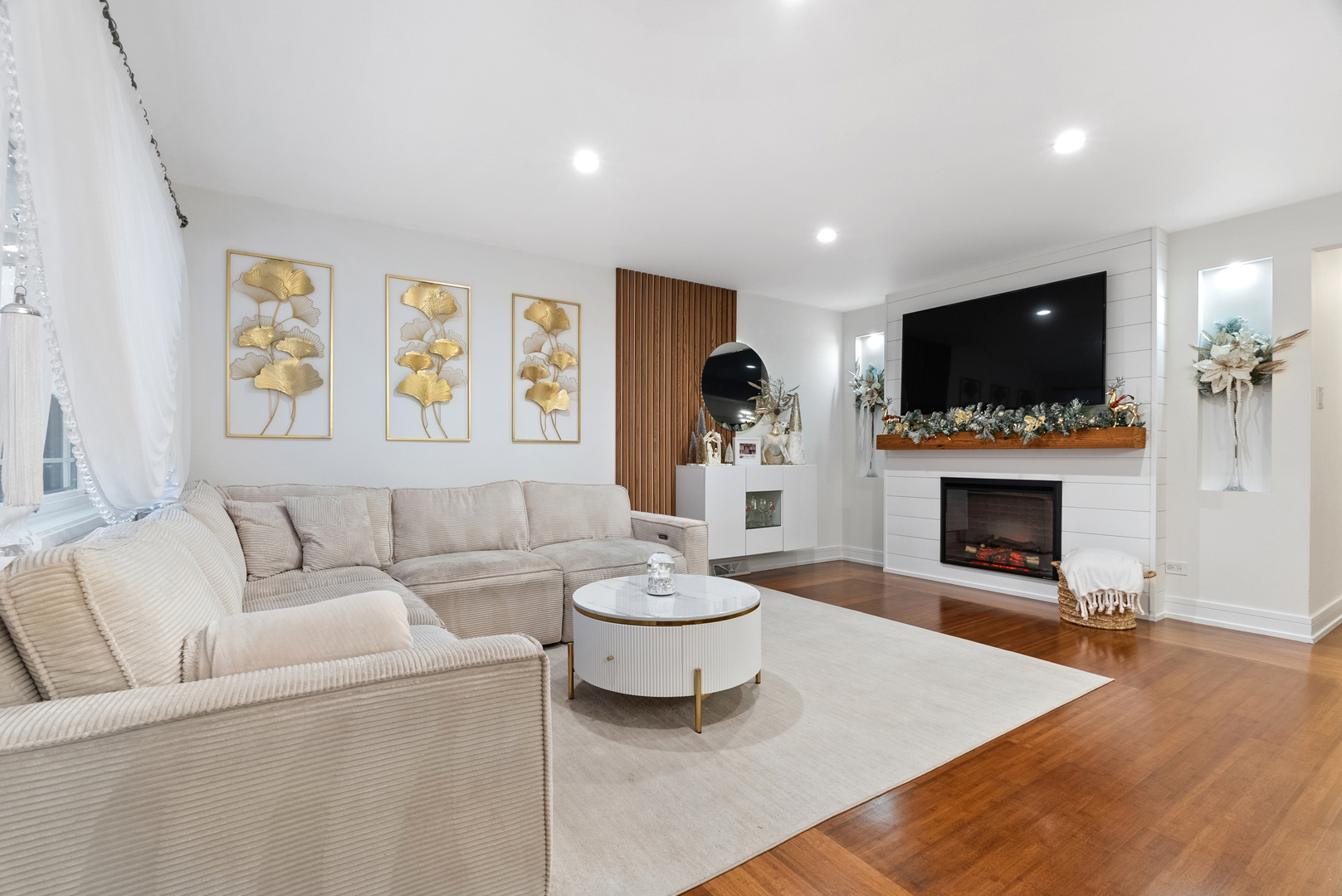 8239 Sayre Avenue Burbank, IL 60459 - Photo 9 of 30 a living room with furniture a flat screen tv and a fireplace