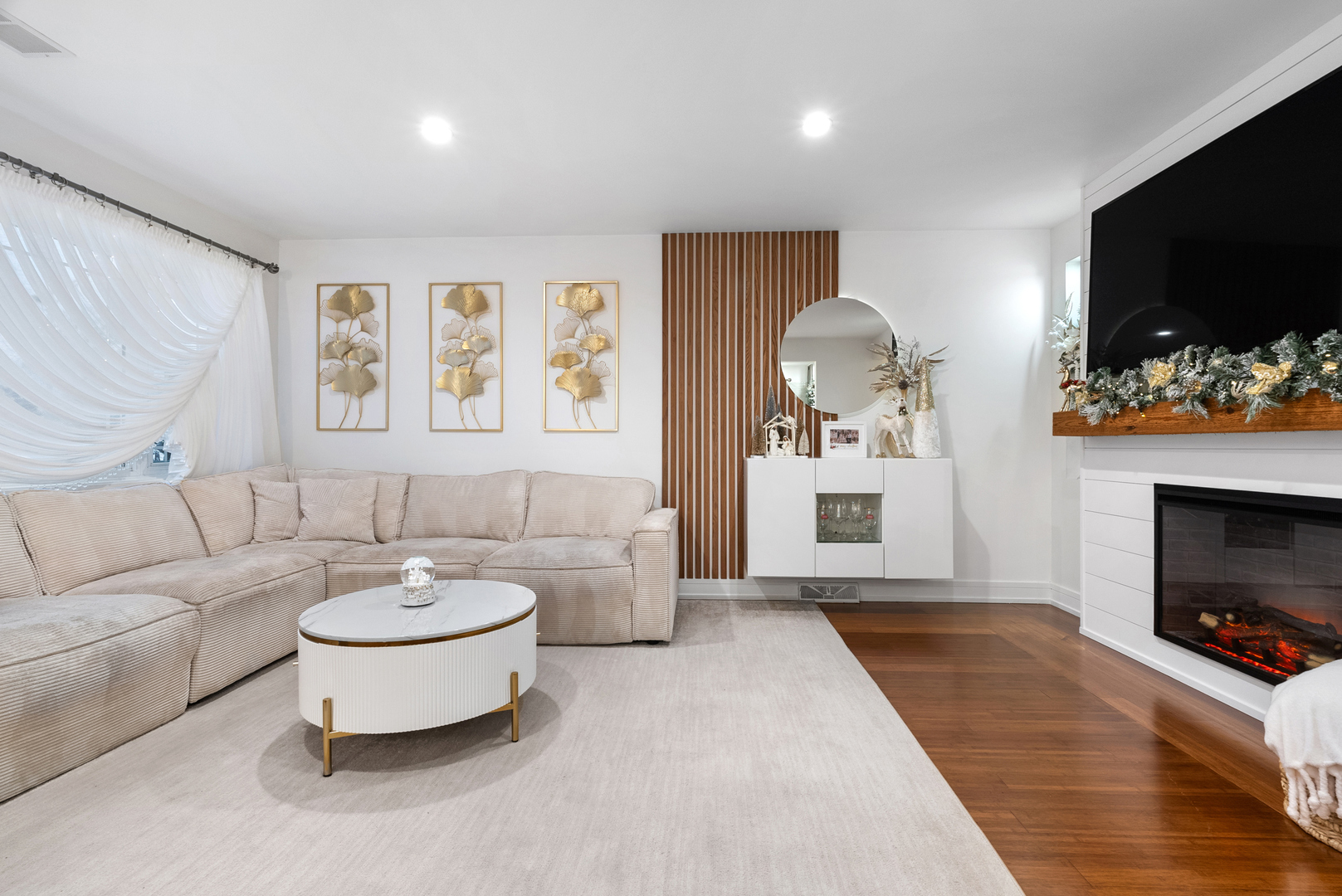 8239 Sayre Avenue Burbank, IL 60459 - Photo 10 of 30 a living room with furniture a flat screen tv and a fireplace