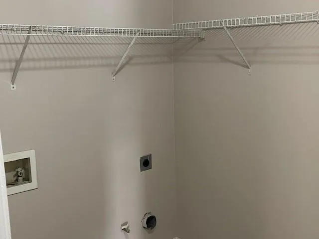 a view of a room with racks on the wall