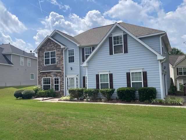 1105 Thornebrooke Court Suwanee, GA 30024 - Photo 2 of 31 a front view of a house with a yard