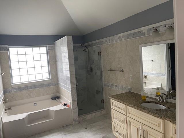 1105 Thornebrooke Court Suwanee, GA 30024 - Photo 21 of 31 a bathroom with a granite countertop sink a mirror and a bathtub