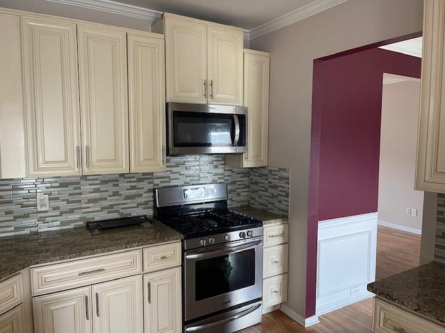 1105 Thornebrooke Court Suwanee, GA 30024 - Photo 29 of 31 a kitchen with granite countertop white cabinets and stainless steel appliances