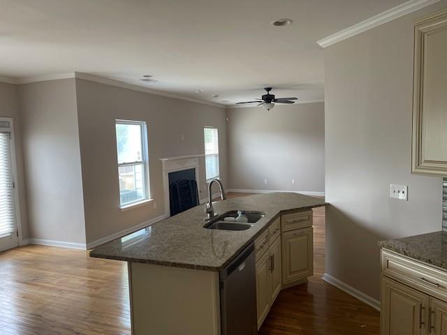 1105 Thornebrooke Court Suwanee, GA 30024 - Photo 30 of 31 a kitchen with granite countertop a sink cabinets and wooden floor