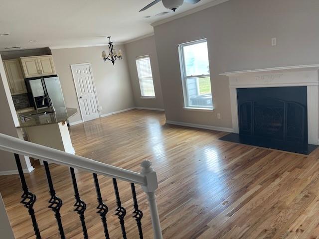 1105 Thornebrooke Court Suwanee, GA 30024 - Photo 31 of 31 wooden floor in an empty room with a fireplace and a window