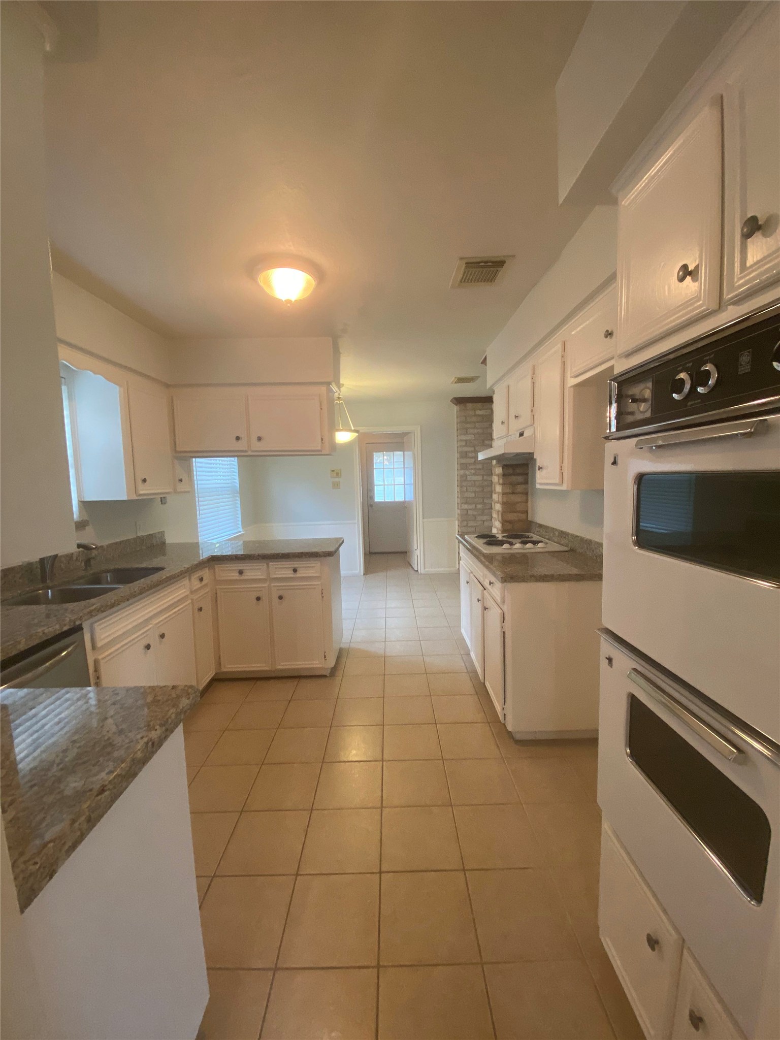 12314 Rincon Drive Houston, TX 77077 - Photo 13 of 36 Kitchen features granite counters, double ovens and new dishwasher.