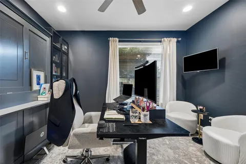 a view of a livingroom with furniture and a flat screen tv