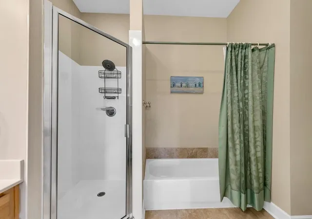 a bathroom with a bathtub and a shower