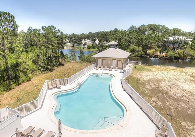a view of a swimming pool with a balcony