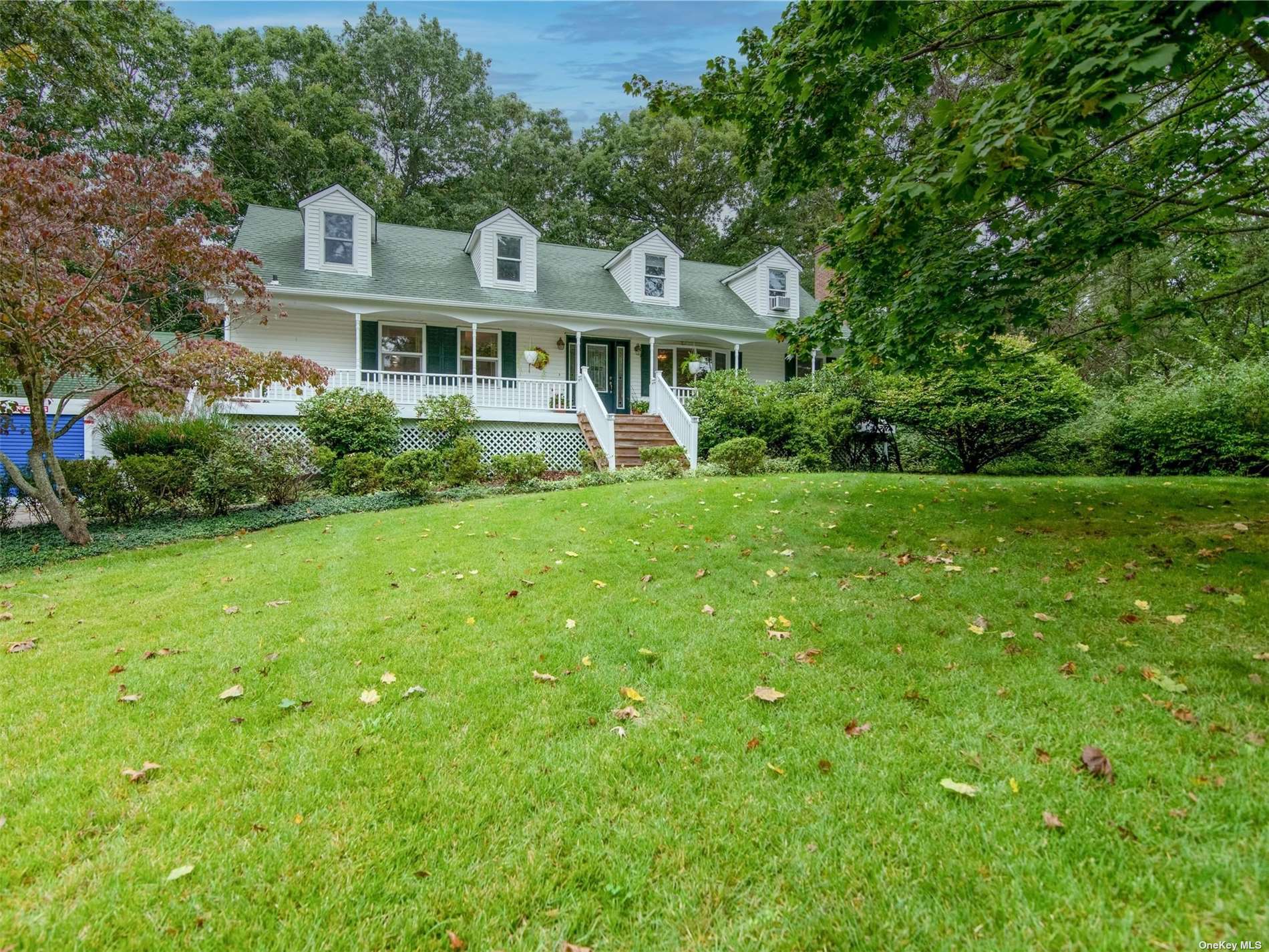 79 North Country Road Shoreham, NY 11786 - Photo 1 of 1 a front view of a house with a garden