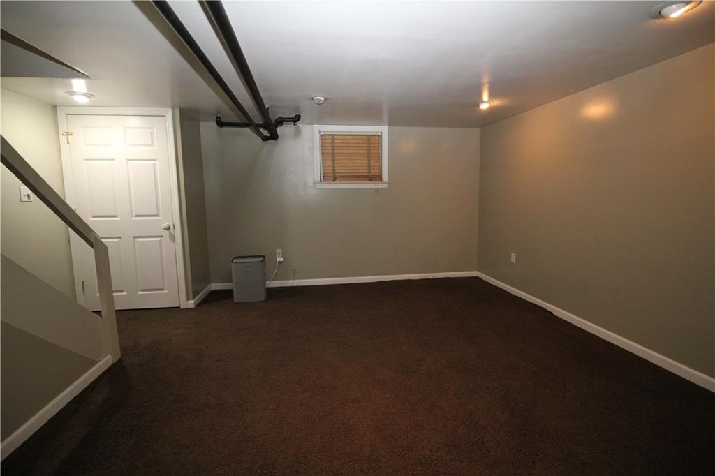 437 Olympia Road Pittsburgh, PA 15211 - Photo 15 of 23 Lower level family room showing with closet. Additional storage/laundry area and full bath off rear of family room.