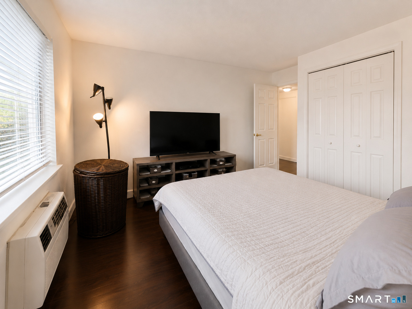 914 High Path Road, Unit 914 Windsor, CT 06095 - Photo 18 of 23 a bedroom with a bed and a flat screen tv