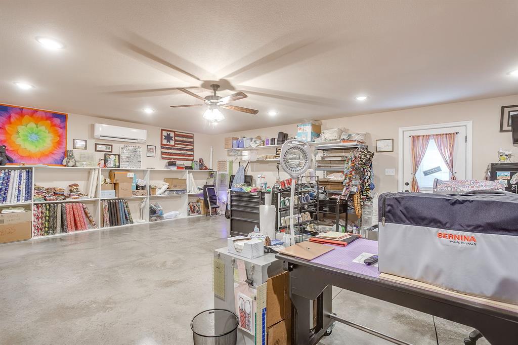 2140 Brown Loop Poolville, TX 76487 - Photo 34 of 38 a living room with lots of furniture and a flat screen tv