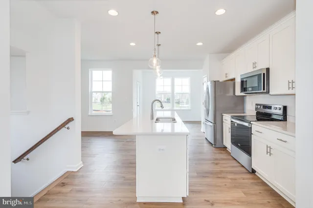 a kitchen with counter top space and sink