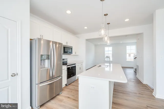 a bathroom with a sink a mirror and a shower