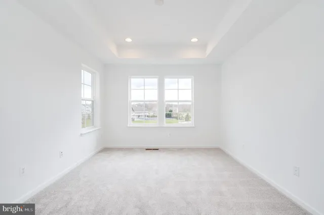 a spacious bathroom with a shower sink and mirror