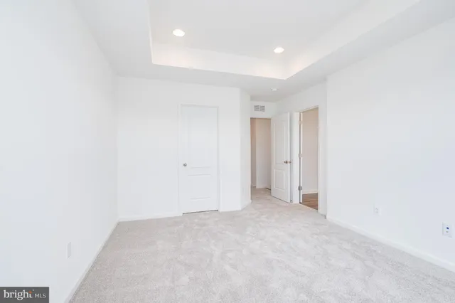 a bathroom with a sink toilet vanity and bathtub