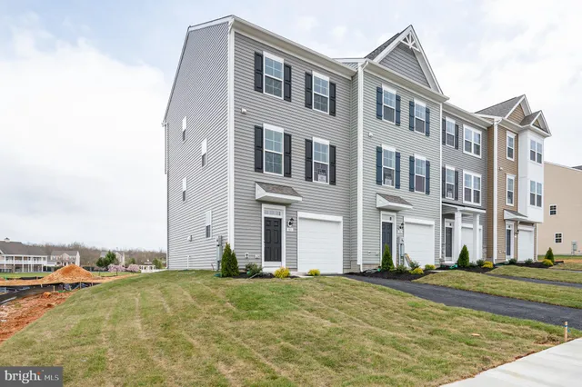 a view of a balcony with floor to ceiling fan yard and outdoor seating