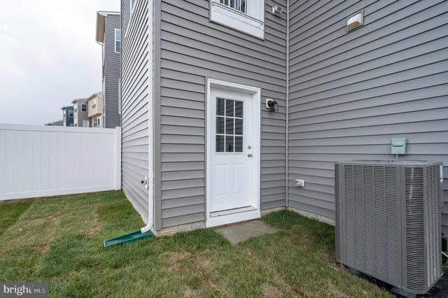 a view of a lake with houses in the back