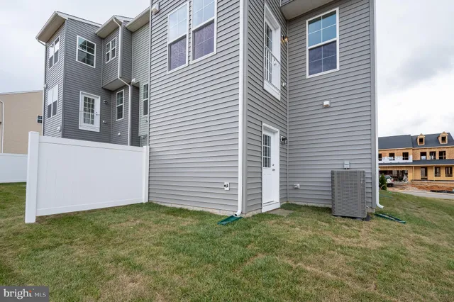 a view of a lake with houses in the back