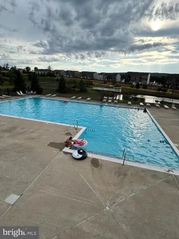 a view of a lake with houses in the back