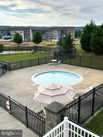 a view of a lake with houses in the back
