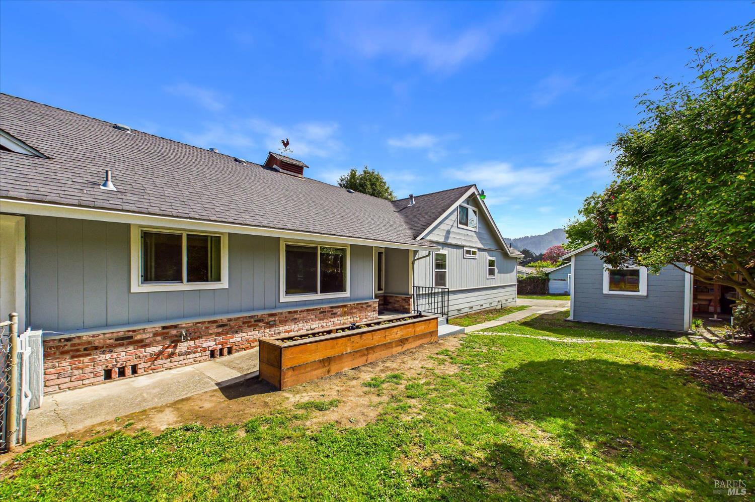 305 Belleview Avenue Rio Dell, CA 95562 - Photo 11 of 76 a front view of a house with a yard and garage