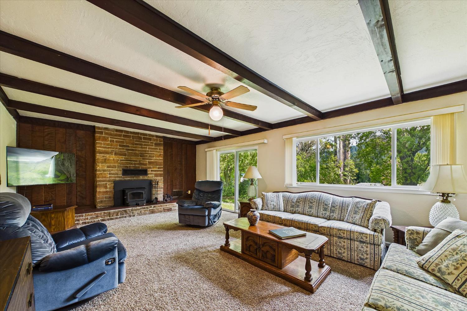 305 Belleview Avenue Rio Dell, CA 95562 - Photo 16 of 76 a living room with furniture and a large window