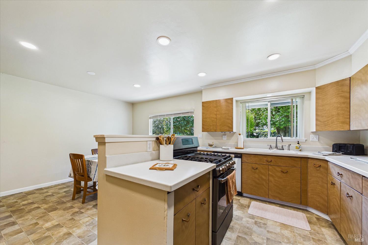 305 Belleview Avenue Rio Dell, CA 95562 - Photo 25 of 76 a kitchen that has a sink and a stove in it