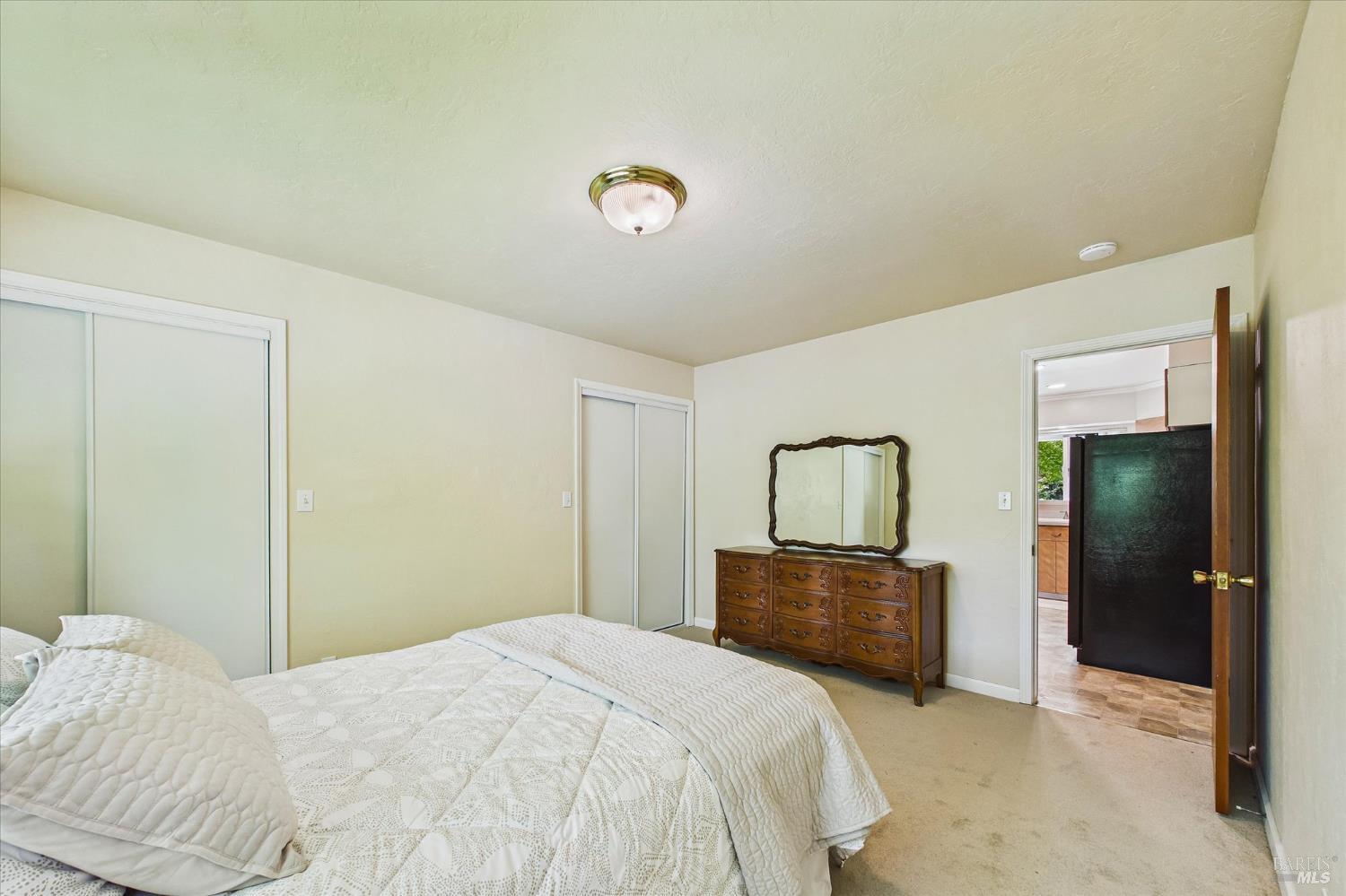 305 Belleview Avenue Rio Dell, CA 95562 - Photo 30 of 76 a bedroom with a bed and a mirror