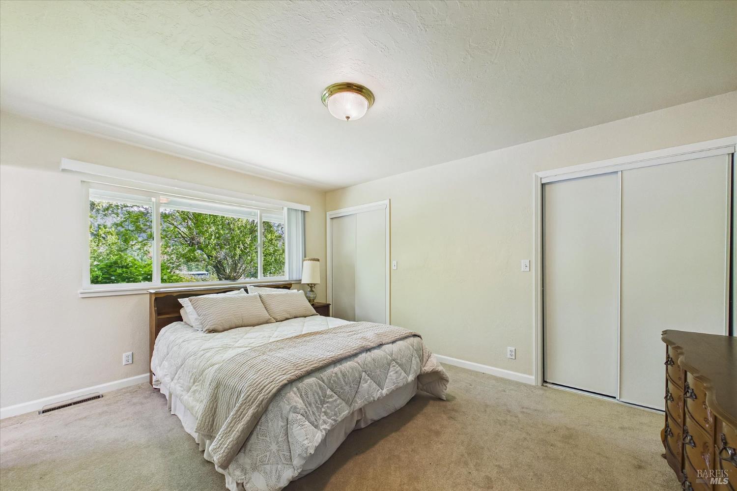 305 Belleview Avenue Rio Dell, CA 95562 - Photo 31 of 76 a bedroom with a bed and a window