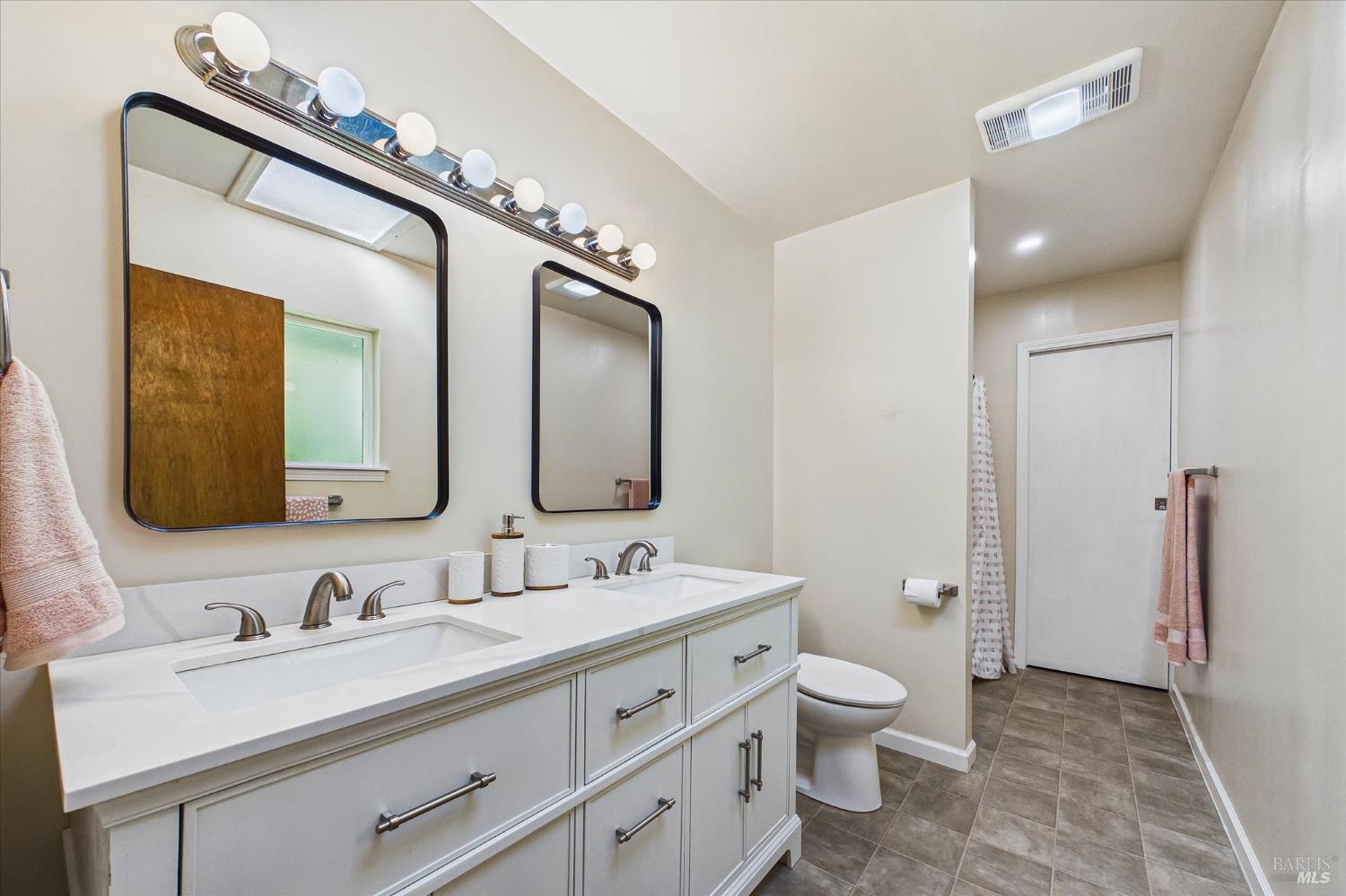 305 Belleview Avenue Rio Dell, CA 95562 - Photo 33 of 76 a bathroom with a toilet a double vanity sink and a mirror