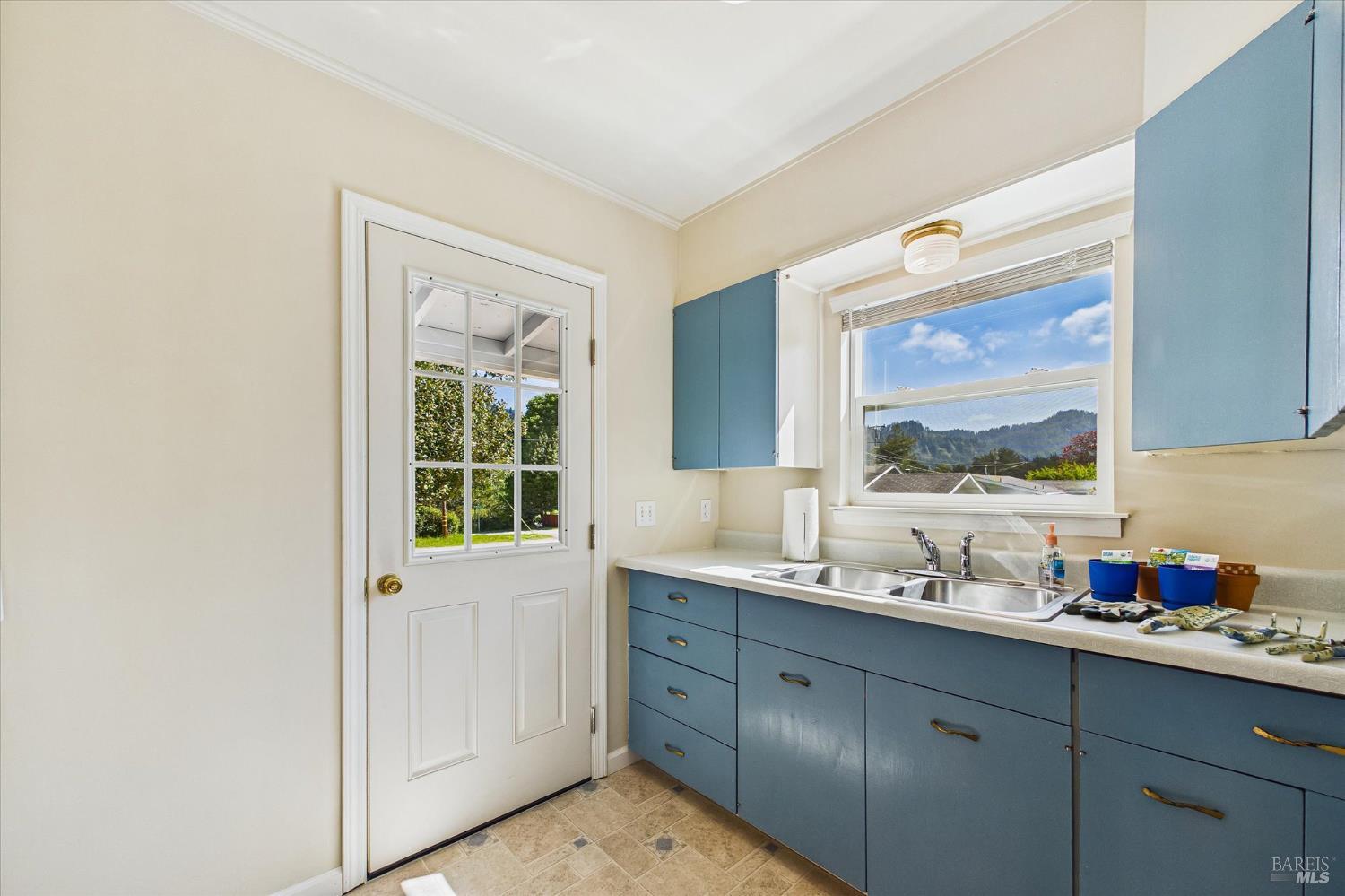 305 Belleview Avenue Rio Dell, CA 95562 - Photo 48 of 76 a bathroom with a granite countertop sink mirror and window