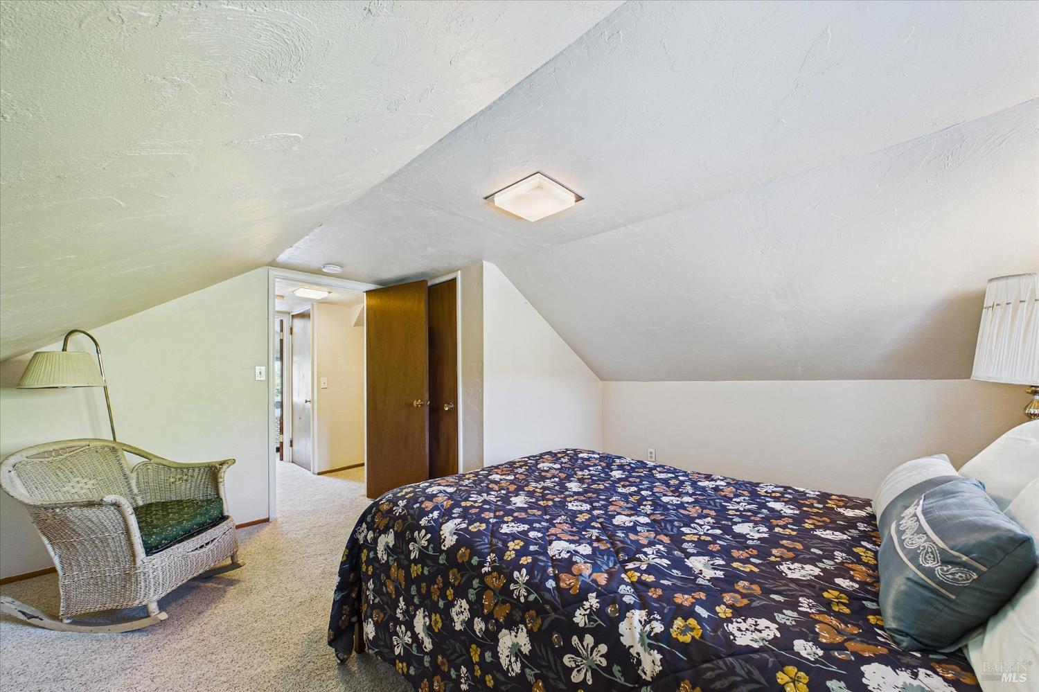 305 Belleview Avenue Rio Dell, CA 95562 - Photo 52 of 76 a bedroom with a bed and a chandelier