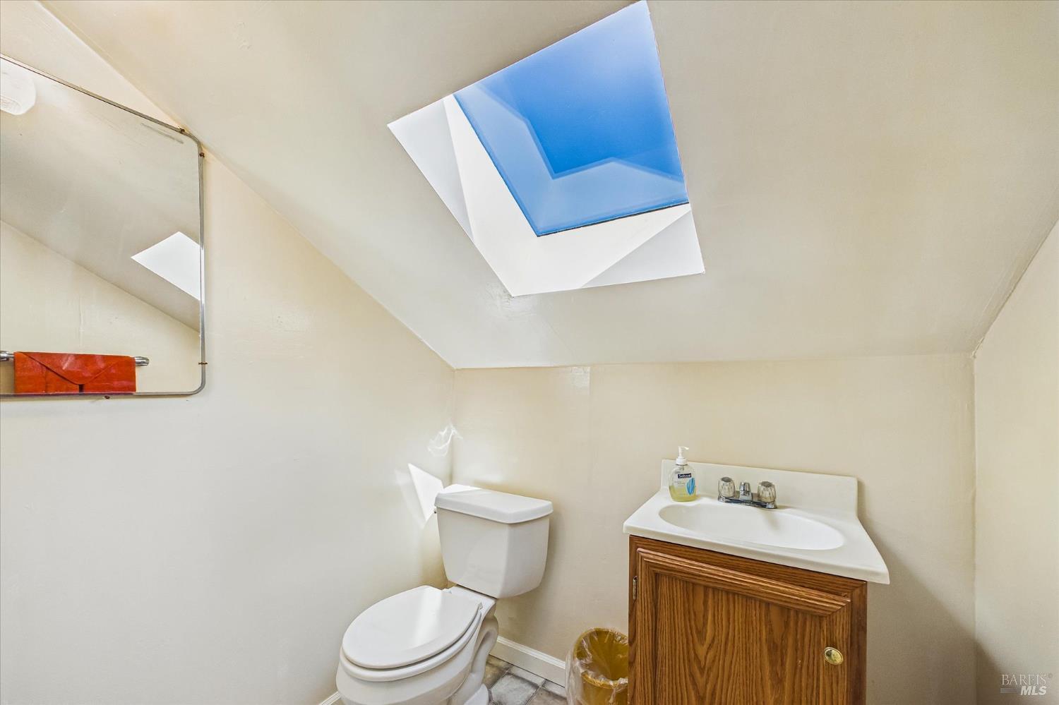 305 Belleview Avenue Rio Dell, CA 95562 - Photo 60 of 76 a bathroom with a toilet sink and mirror