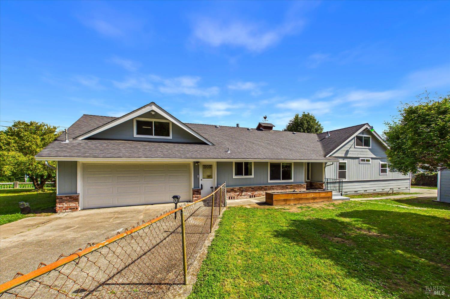 305 Belleview Avenue Rio Dell, CA 95562 - Photo 10 of 76 a front view of a house with a yard