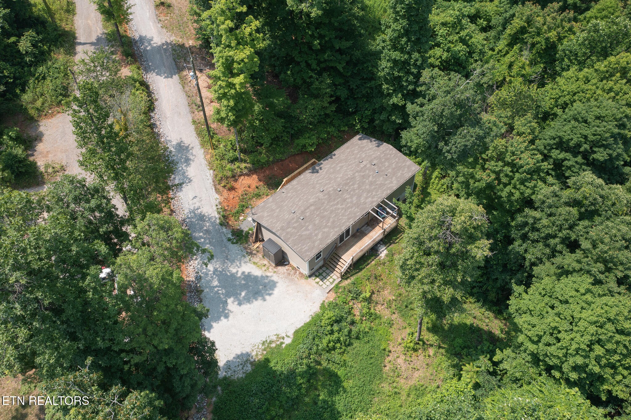 297 Wells Road Powell, TN 37849 - Photo 15 of 15 an aerial view of a house with a yard and large trees